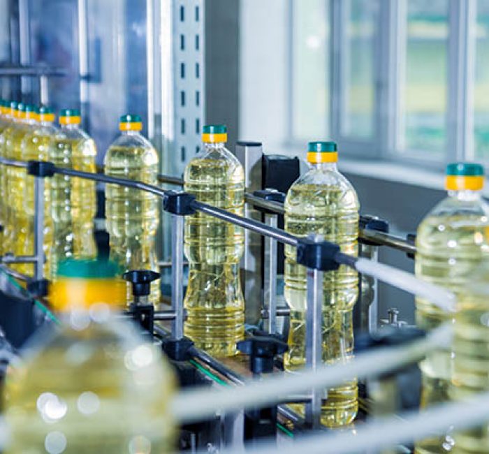 Bottling Line Of Sunflower Oil In Bottles. Vegetable Oil Production Plant